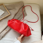 Hand holding diagonal cloud bag